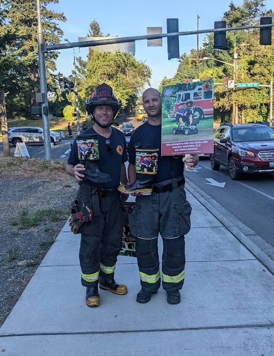 Ray Austin and another firefighter in the community